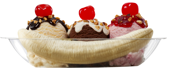 A banana split with three scoops of ice cream topped with nuts, sauce, and cherries in a glass bowl.