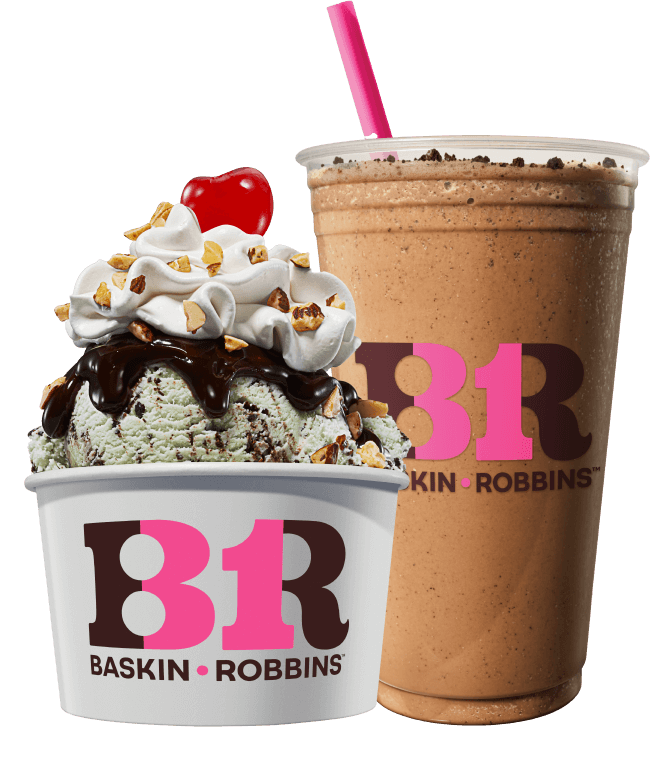 A bowl of baskin-robbins ice cream topped with whipped cream, nuts, and a cherry, next to a chocolate milkshake with a pink straw.